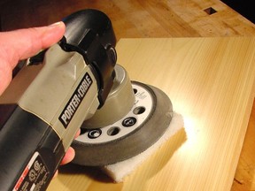 This random orbit sander is sitting on a super-fine 3M rubbing pad, ready to buff a urethane finish. This final finishing step creates glass-smooth results.