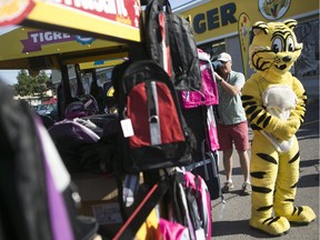 Giant Tiger donated 500 backpacks to Caring and Sharing Exchange for underprivileged school children at the company's headquarters in Ottawa in August, 2014.