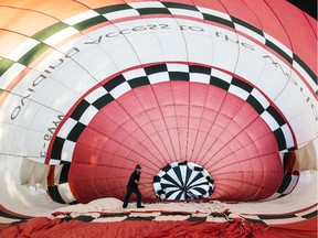 Hal Cooper gets his balloon ready before a morning flight in Gatineau Friday, August 29, 2014.