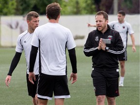 Head coach Marc Dos Santos makes a point to his players as the Ottawa Fury practise in mid-August.