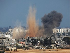 A picture taken from the Israeli side of the Israel-Gaza Border on August 10, 2014 shows smoke rising from the coastal side of the Gaza strip following an Israeli military strike. Israel will not return to talks to end the conflict in Gaza while Palestinian militants continue cross-border rocket attacks, Prime Minister Benjamin Netanyahu said.