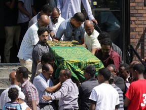 Jabier Jemmie's casket is lifted by pall bearers from Ottawa mosque after his funeral on Northwestern St. in Ottawa, Sunday, August 24, 2014. The 21-year-old Jemmie was stabbed to death outside an Elgin St. bar early Saturday morning.