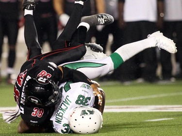 James Green (38) of the Ottawa Redblacks tackles Tristan Jackson (38) of the Saskatchewan Roughriders during the second half of CFL game action at TD Place in Ottawa on Saturday, Aug. 2, 2014.