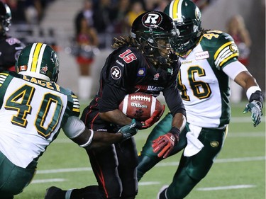 Jamill Smith ploughs through some heavy defence during the Ottawa Redblacks Friday night matchup against the Edmonton Eskimos at TD Place in Ottawa, August 15, 2014.