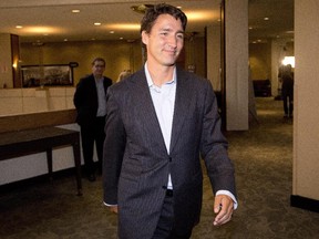 Liberal Leader Justin Trudeau makes his way to the federal Liberal Party's summer caucus meeting in Edmonton Tuesday.