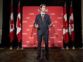 Liberal Leader Justin Trudeau speaks to media during a break at the federal Liberal summer caucus meeting in Edmonton on Tuesday, Aug. 19, 2014.