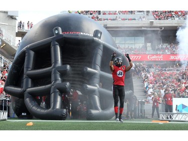 Khalil Paden #13 of the Ottawa Redblacks wears the new 3rd jersey as the players are introduced prior to a CFL match against the Calgary Stampeders at TD Place in Ottawa on August 24, 2014.
