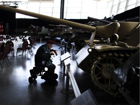 Korean War veteran Harold F. True looks at tanks before a reception for the 100th anniversary of the beginning of the First World War at the National War Museum in Ottawa on Aug. 4, 2014.