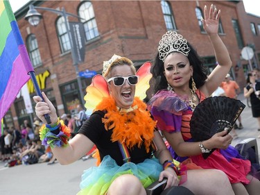 (L-R) Mister Capital Pride, Master Cameron Eric Leon and Miss Capital Pride, Jade London at the Capital Pride Parade on Bank St. on Sunday, Aug. 24, 2014.