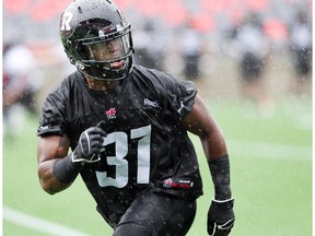 Linebacker Jasper Simmons looks to make a play as the Ottawa Redblacks practice at TD Place on a rainy Tuesday.