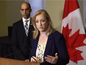 Transport Minister Lisa Raitt speaks to the media with Minister of Public Safety Steven Blaney following the release of the Transportation Safety Board's final report from its investigation into the July 6, 2013 train derailment in Lac-Megantic, Quebec, on Parliament Hill in Ottawa on Tuesday, August 19, 2014.
