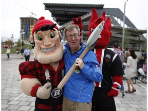 Mayor Jim Watson with Redblacks mascot Big Joe Mufferaw.