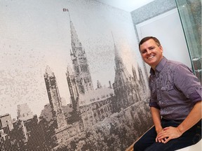 More than 50,000 pieces of tile were used to create a mosaic of the Parliament Buildings in Michael MacKay’s bathroom. Using the image on old $1 bills as a guide, it took five months to make the black and white mural, which has a pop of red in the flag.