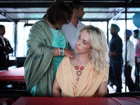 Nin Sandhu fixes Meghan Pyne's traditional Punjabi outfit on a boat on the first evening launch of the SouthAsian Fest in Gatineau on Friday, August 15, 2014.