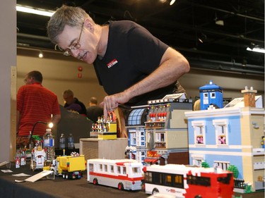 Norbert Black, Parlugment, points to one of his models during the Ottawa Maker Faire being held at the Canada Science and Technology Museum on August 17, 2014.