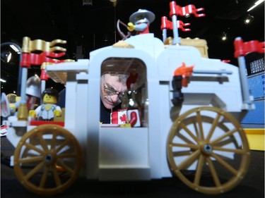 Norbert Black, Parlugment, works on painting Legos during the Ottawa Maker Faire being held at the Canada Science and Technology Museum on August 17, 2014.