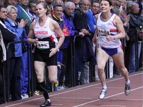 Ottawa Lions Track and Field Club's Wendy Alexis, left, heads for the finish line and a victory in the women's 55-59 age group 200-metre final at the world masters indoor athletics championships in Budapest.
