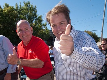 Ottawa Mayor Larry O'Brien, left, and Councillor Peter Hume give the thumbs up at the 13th Annual Charity Grape Stomp on Preston Street on September 20, 2009. They were part of the VIP team the "Unstompables" consisting of other community leaders including John Baird (Federal Conservative MP Ottawa West-Nepean and Minister of Transport, Infrastructure and Communities) and Jim Watson (Ontario Liberal MPP Ottawa West - Nepean and Minister of Municipal Affairs and Housing) who officially opened the 13th Annual Charity Grape Stomp on Preston Street in Ottawa Ontario, September 20, 2009. The Grape Stomp marks the last day of the week-long Preston Street Business Improvement Area (BIA) La Vendemmia Festival, which is Ottawa's annual celebration of Italian wine and food. The stomp competition is a four stage timed team relay event consisting of a grape stomp, pizza toss, pasta making, and the setting of a dinner table. Proceeds from the stomp go to the Ottawa Regional Cancer Foundation to support lung cancer research in Ottawa. The money raised is earmarked to hire a new junior researcher. At the start of the Grape Stomp event almost $10,000 had been raised, with more coming in as the afternoon proceeds.