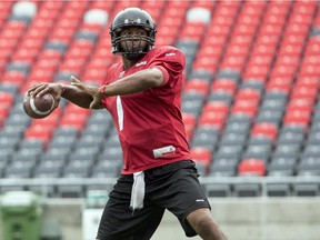 Ottawa RedBlacks' QB Henry Burris looks to throw the ball downfield during team practice at TD Place Thursday August 21, 2014.