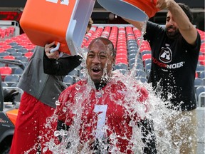 Ottawa Redblacks quarterback Henry Burris gets doused with two ice chests full of freezing water after practice Thursday -  all for a good cause, however. The Ice Bucket Challenge has become a viral sensation to raise money for ALS.