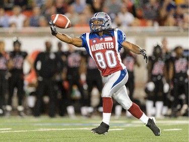 James Rodgers #80 of the Montreal Alouettes tries to catch the ball against the Ottawa Redblacks during the CFL game at Percival Molson Stadium on August 29, 2014 in Montreal.