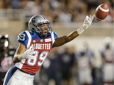 S.J. Green #19 of the Montreal Alouettes misses a pass against the Ottawa Redblacks during the CFL game at Percival Molson Stadium on August 29, 2014 in Montreal.