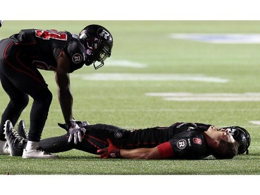 Ottawa's Antoine Pruneau yells in agony following a leg injury in the dying minutes of Ottawa Redblacks Friday night matchup against the Edmonton Eskimos at TD Place in Ottawa, August 15, 2014.