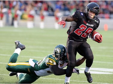 Ottawa's Chevon Walker shakes off a tackle for a run down the field during the first half.  Ottawa Redblacks Friday night matchup against the Edmonton Eskimos at TD Place in Ottawa, August 15, 2014.