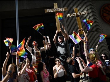 Participants at the Capital Pride Parade join the protesters on Laurier Ave. on Sunday, Aug. 24, 2014. (James Park / Ottawa Citizen)