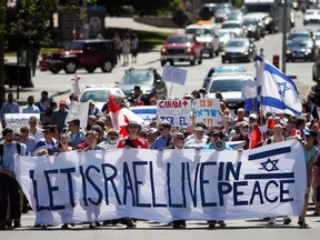 Demonstrators march along Elgin Street on their way to Parliament Hill on Wednesday in support of Israel.