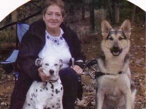 Fire victim Nancy Price, with Damien the Dalmatian, which also died in the fire and Buddy the German shepherd, which survived.