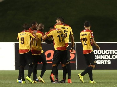 Players from the Fort Lauderdale Strikers celebrate their second goal against the Ottawa Fury during an NASL match at TD Place in Ottawa on August 9, 2014.