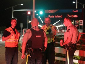 Police block access to Bate Island during a water and land search for a missing man in Ottawa on Saturday, August 23, 2014.