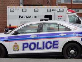 Police cruiser and ambulance outside Civic Campus of the Ottawa Hospital in Ottawa, Wednesday, June 18, 2014. Several police officers and paramedics were injured, two seriously, during a joint training incident in Kanata earlier today. Mike Carroccetto / Ottawa Citizen