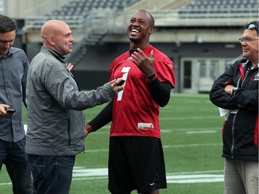 QB Henry Burris yucks it up with reporters after practice.  Ottawa Redblacks run through a light practice Thursday, August 14, 2014 at TD Place stadium before Friday night's home game against the Edmonton Eskimos.