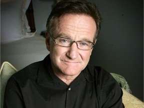 FILE - This June 15, 2007 file photo shows actor and comedian Robin Williams posing for a photo in Santa Monica, Calif. Williams, whose free-form comedy and adept impressions dazzled audiences for decades, died Monday, Aug. 11, 2014, in an apparent suicide. Williams was 63.