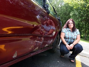 Sandra Laprise was told to drive her car to a reporting centre even though her driver's door was smashed and wouldn't open.