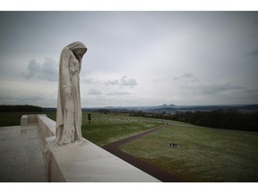 VIMY, FRANCE - MARCH 26: A sculpture entitled 'Mother Canada' looks out from the Canadian National Vimy Memorial on March 26, 2014 in Vimy, France.