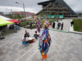 Stilt walkers and native drummers perform as the official opening of Lansdowne Park takes place and is the culmination of more than a year of intensive construction to complete the new 18-acre urban park.