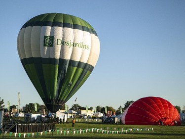 The Desjardins balloon is inflated before a morning flight in Gatineau Friday, August 29, 2014.