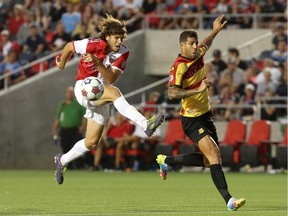 Tom Heinemann (L) of the Ottawa Fury goes against Rafael Alves of the Fort Lauderdale Strikers during Saturday night's NASL match at TD Place.