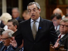 Treasury Board President Tony Clement responds to a question during question period in the House of Commons on Parliament Hill in Ottawa on Tuesday, June 3, 2014.