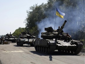 Ukrainian troops patrol near the eastern Ukrainian city of Debaltseve in the Donetsk region on August 3, 2014.