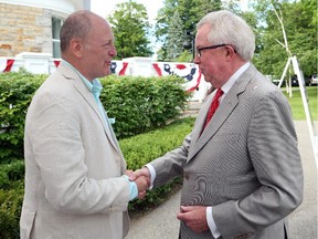 Former prime minister Joe Clark, right, is seen at the Fourth of July party this summer with U.S. Ambassador Bruce Heyman.