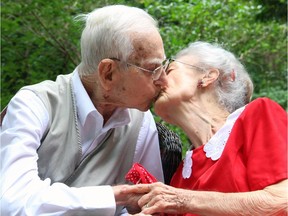 War veteran George Spear, 94, and his war bride, Jean Spear, 91, celebrated their 72nd wedding anniversary with a loving kiss during a tea party hosted in their Ottawa backyard on Friday, August 22, 2014.