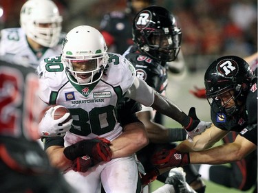 Will Ford of the Saskatchewan Roughriders tries to break through Ottawa Redblacks' defence during the second half of CFL game action at TD Place in Ottawa on Saturday, Aug. 2, 2014.