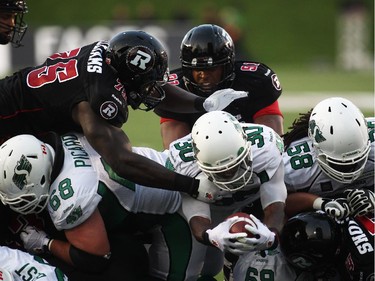 Will Ford of the Saskatchewan Roughriders breaks through Ottawa Redblacks defence for a touchdown during the first half of CFL game action at TD Place in Ottawa on Saturday.
