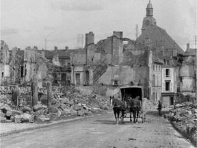 A picture taken by an ex-serviceman in in 1916 shows a horse-drawn carriage passing through the ruined French city of Verdun, during the First World War.