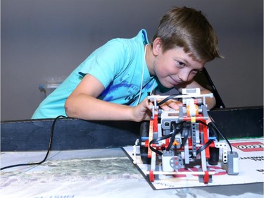 Zachery Bruketa, 10, demonstrates one of his robots during the Ottawa Maker Faire being held at the Canada Science and Technology Museum on August 17, 2014.