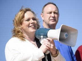 Nepean-Carleton Tory MPP Lisa MacLeod leads a protest in May 2014 with fellow MPP John Yakabuski.